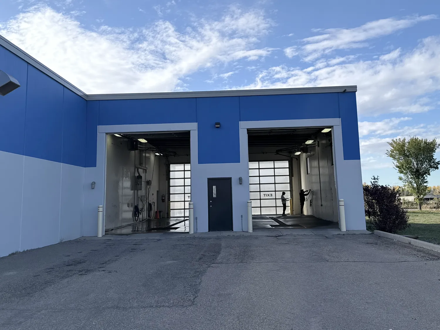 The two RV and truck bays with their doors open, the exit doors visible at the far end of each